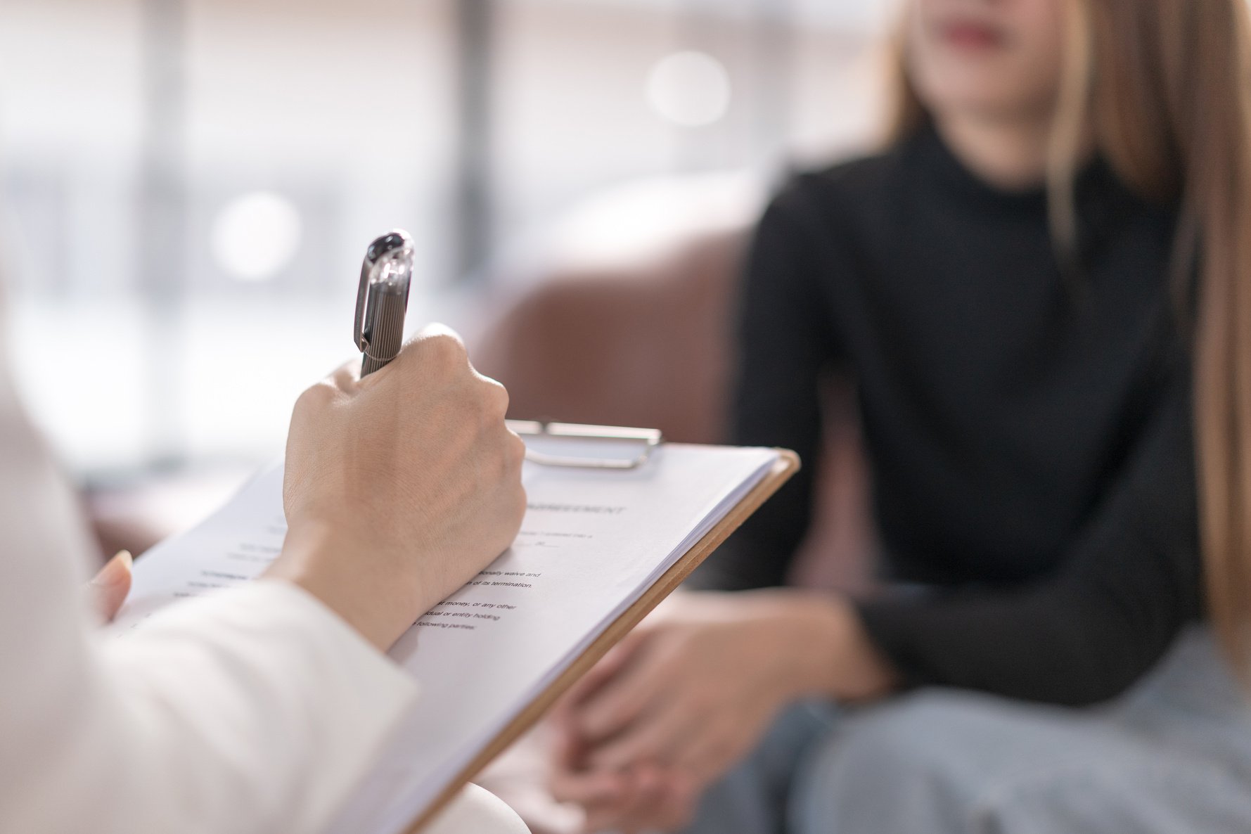 Young Woman with Mental Health Problem Meets Psychologist